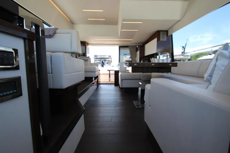 Slide: The Image of Luxurious interior of a 2022 Prestige 520 yacht with modern seating and sleek design. - 45