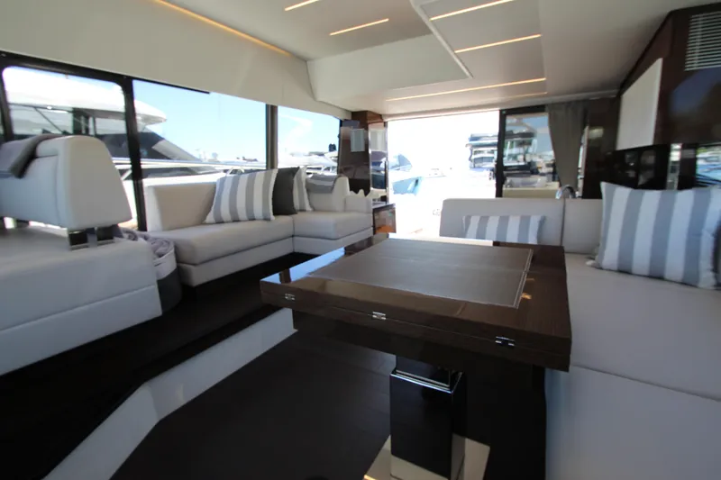 Slide: The Image of Luxurious interior of a 2022 Prestige 520 yacht with elegant seating and modern design. - 46