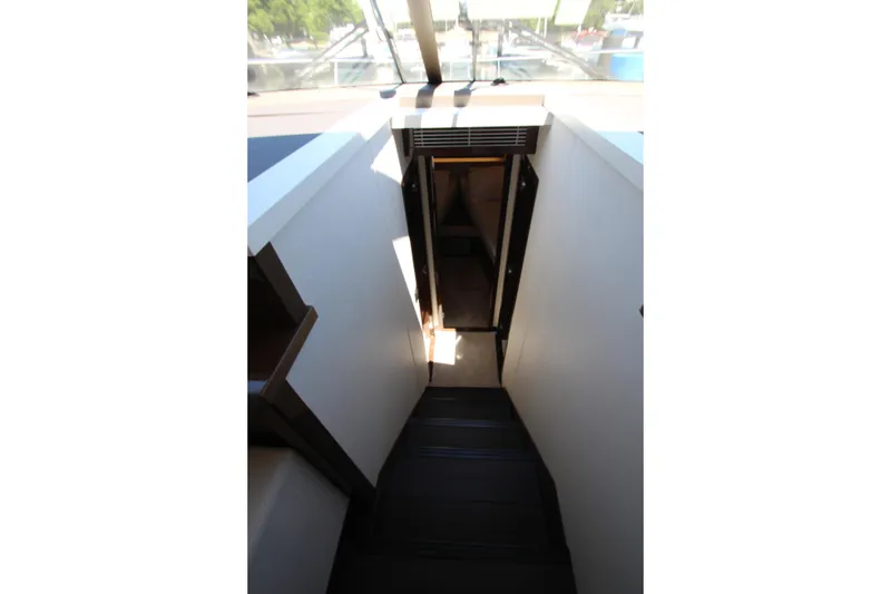 Slide: The Image of Staircase leading to lower deck on 2022 Prestige 520 yacht interior. - 47