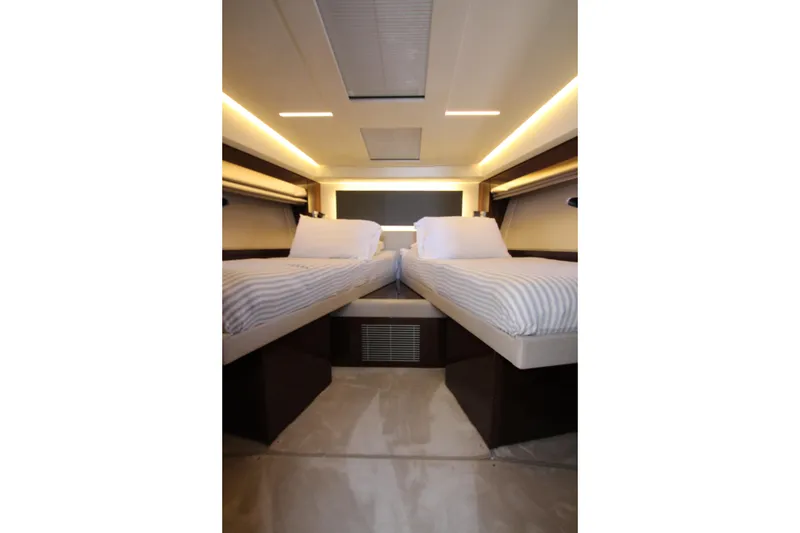 Slide: The Image of Luxurious twin cabin interior of 2022 Prestige 520 yacht, featuring modern design and ambient lighting. - 49