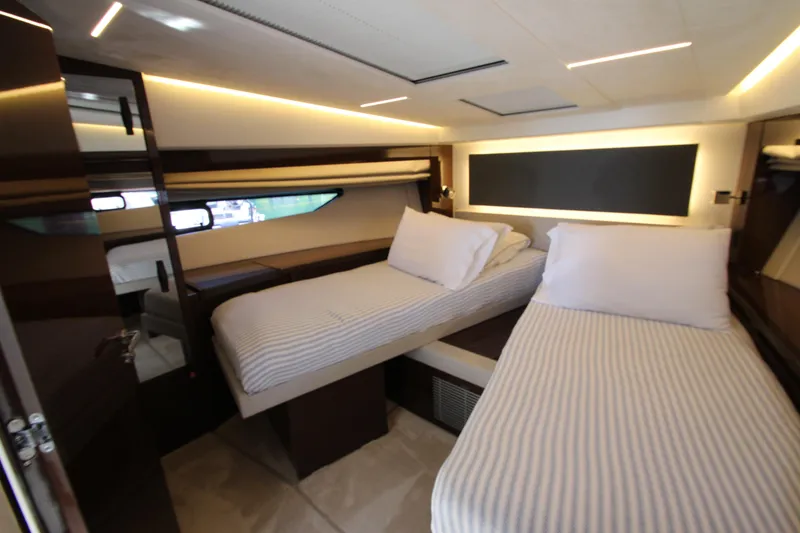 Slide: The Image of Luxurious twin cabin interior of 2022 Prestige 520 yacht with modern lighting. - 51