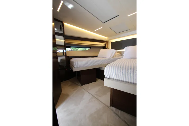 Slide: The Image of Luxurious interior of 2022 Prestige 520 yacht with twin beds and modern lighting. - 52