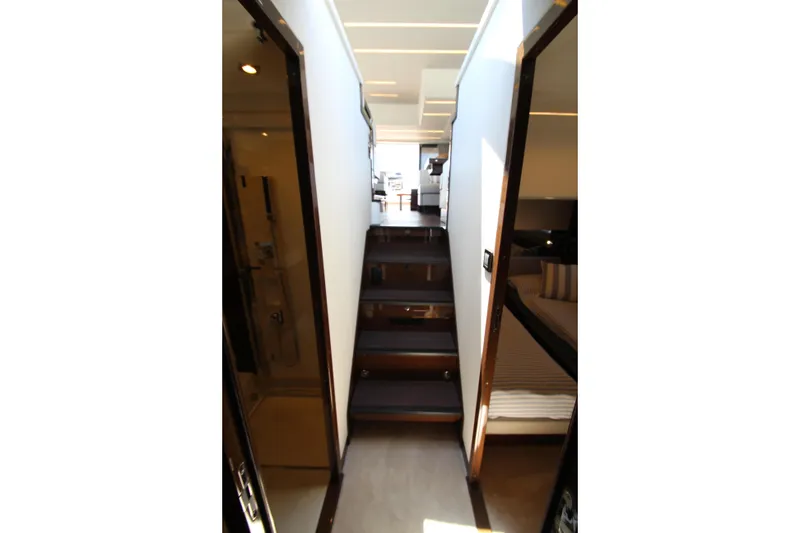 Slide: The Image of Interior hallway of 2022 Prestige 520 yacht with modern design and wooden stairs. - 56