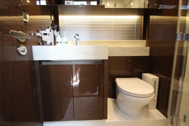 Slide: The Image of Luxurious bathroom interior on a 2022 Prestige 520 yacht, featuring modern fixtures and elegant design. - 65