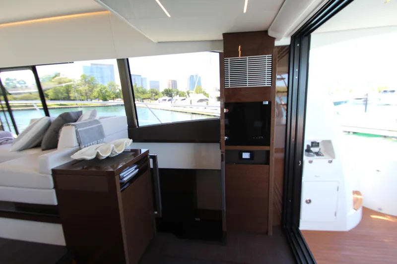 Slide: The Image of Luxurious interior of 2022 Prestige 520 yacht with modern furnishings and large windows. - 66