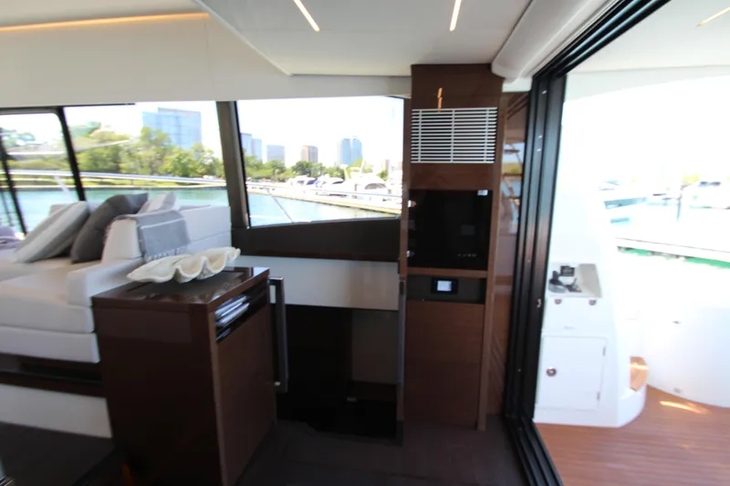 Slide: The Image of Luxurious interior of 2022 Prestige 520 yacht with modern design and scenic marina view. - 67