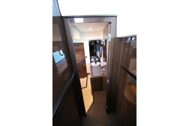 Slide: The Image of Interior view of 2022 Prestige 520 yacht, featuring sleek wood finishes and modern design. - 71