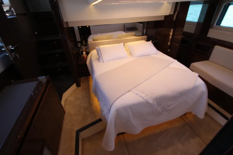 Slide: The Image of Luxurious bedroom interior of 2022 Prestige 520 yacht with elegant bedding and modern design. - 72