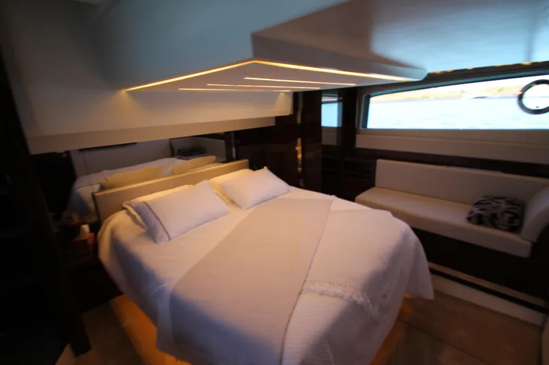 Slide: The Image of Luxurious bedroom interior of 2022 Prestige 520 yacht with modern lighting and elegant furnishings. - 73