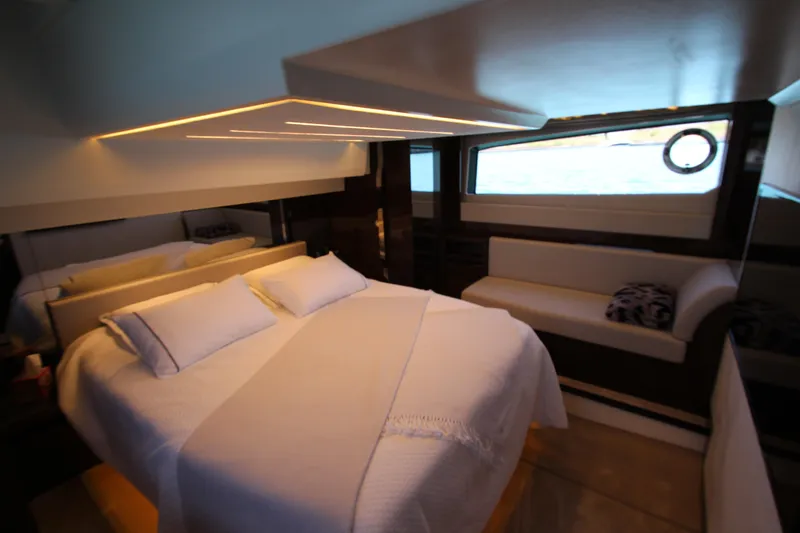 Slide: The Image of Luxurious bedroom interior of 2022 Prestige 520 yacht with modern design and ambient lighting. - 74