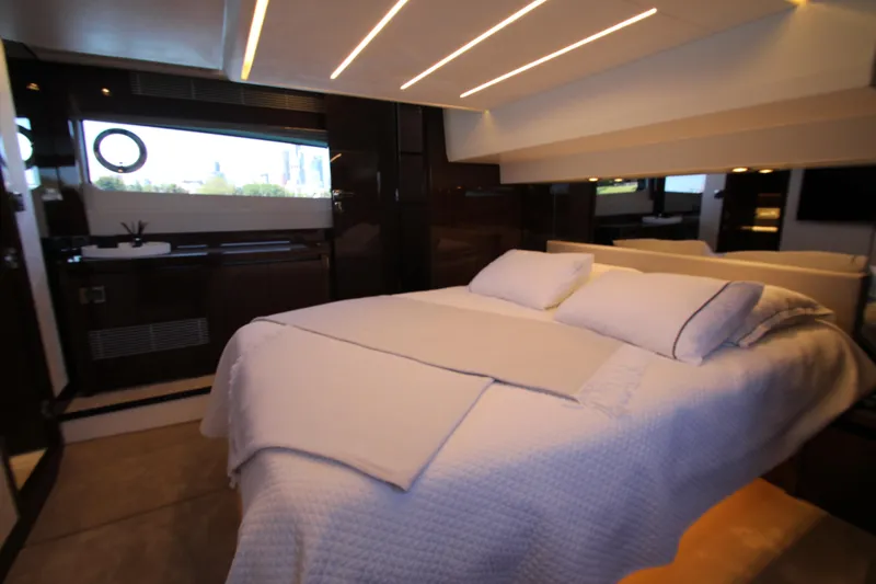 Slide: The Image of Luxurious bedroom interior of 2022 Prestige 520 yacht with modern lighting and elegant decor. - 81
