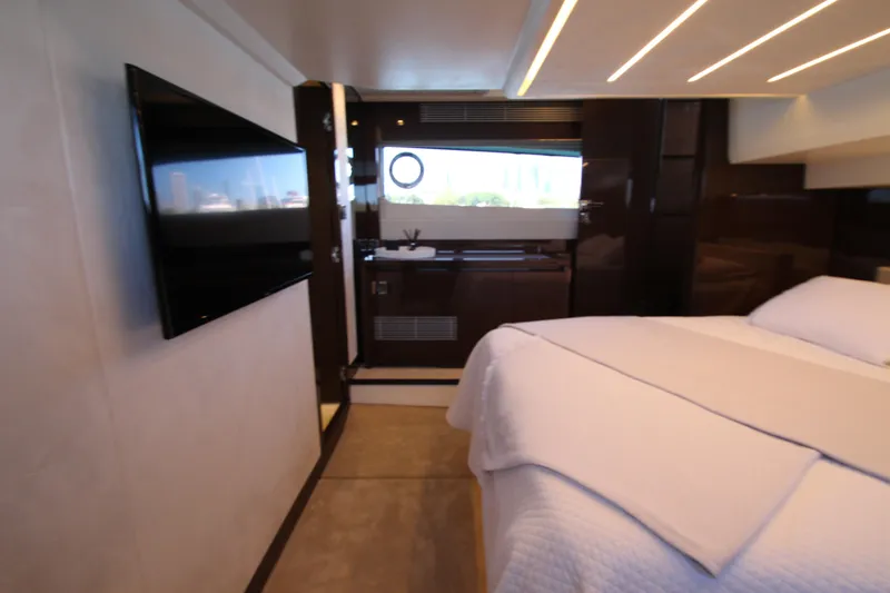 Slide: The Image of Luxurious interior of 2022 Prestige 520 yacht with modern bedroom and flat-screen TV. - 83