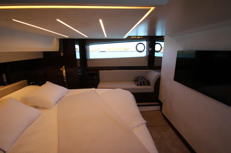 Slide: The Image of Luxurious interior of 2022 Prestige 520 yacht with modern bedroom and scenic window view. - 84