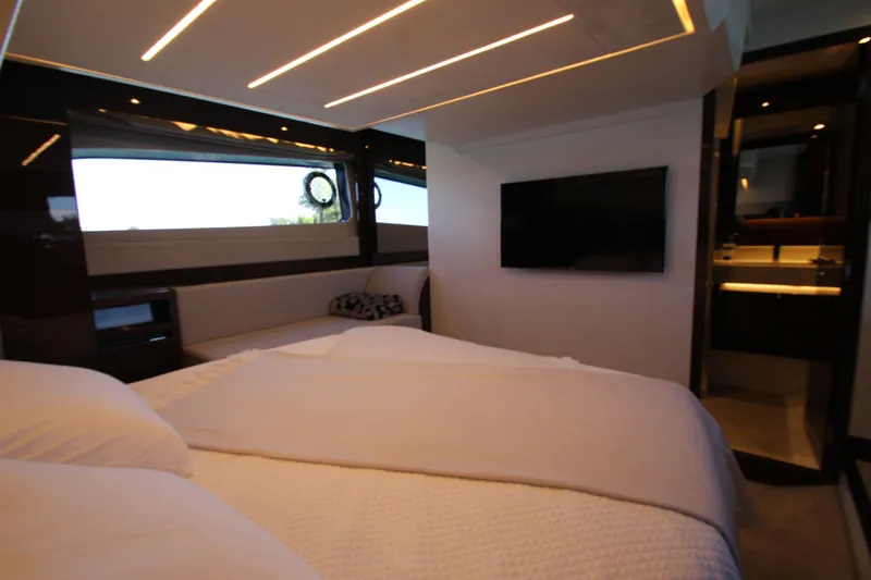 Slide: The Image of Luxurious interior of 2022 Prestige 520 yacht bedroom with modern design and ambient lighting. - 85