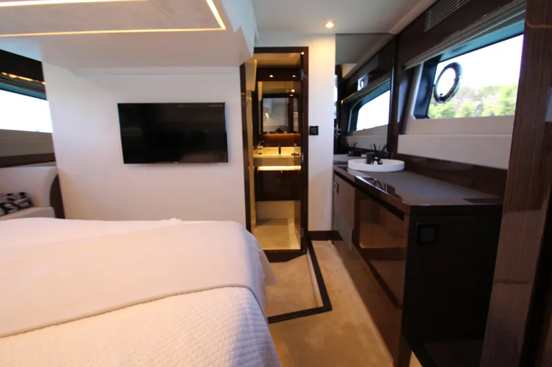 Slide: The Image of Luxurious interior of 2022 Prestige 520 yacht featuring modern amenities and elegant design. - 86