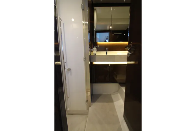 Slide: The Image of Luxurious bathroom interior of 2022 Prestige 520 yacht, featuring modern sink and elegant lighting. - 87
