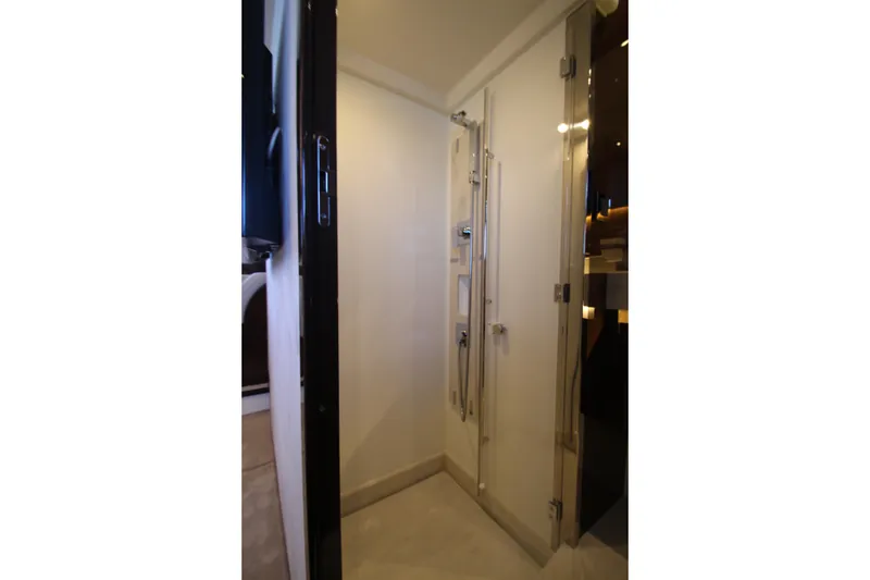 Slide: The Image of Modern shower area in 2022 Prestige 520 yacht, featuring sleek design and glass door. - 88