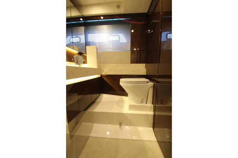 Slide: The Image of Luxurious bathroom interior on a 2022 Prestige 520 yacht, featuring modern fixtures and sleek design. - 89