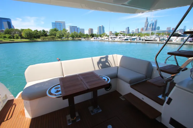Slide: The Image of Luxurious 2022 Prestige 520 yacht deck with city skyline and marina view. - 91