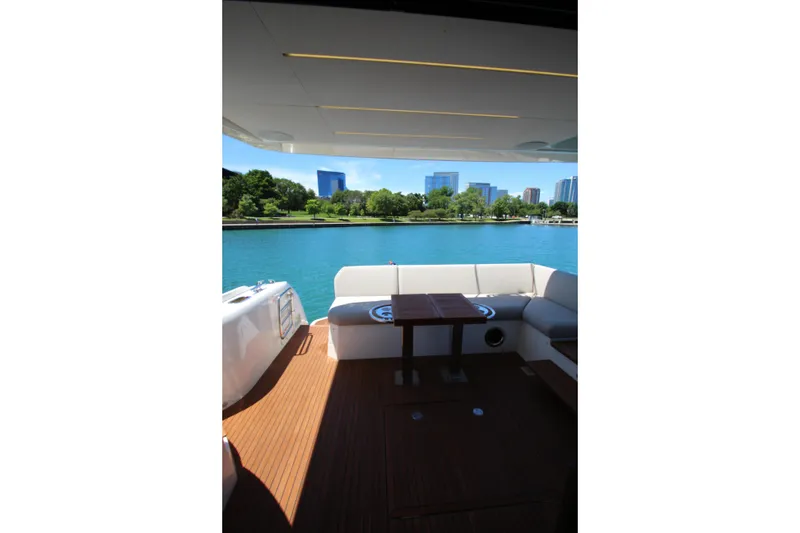Slide: The Image of Luxurious 2022 Prestige 520 yacht interior with waterfront cityscape view. - 96