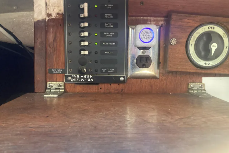 Slide: The Image of Electrical panel on a 1979 CAL 34-III sailboat with switches and outlets. - 24
