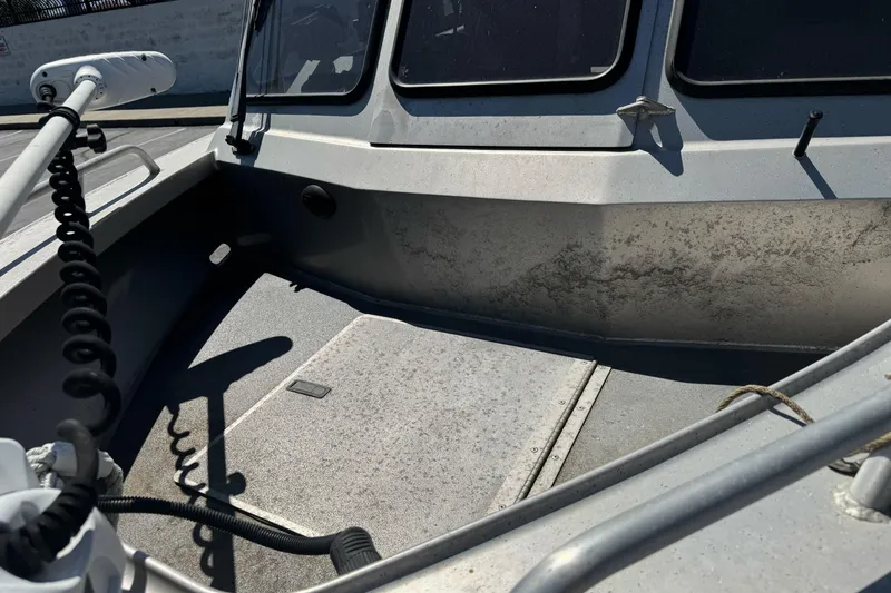 Slide: The Image of 2011 North River 21' Seahawk boat interior with visible wear and equipment. - 11