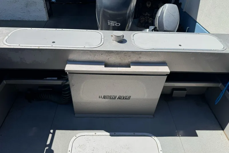 Slide: The Image of 2011 North River 21' Seahawk boat interior with Yamaha 150 engine. - 15