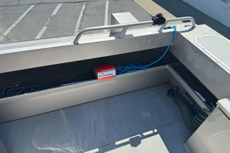 Slide: The Image of Interior of a 2011 North River 21' Seahawk boat with storage compartment. - 16