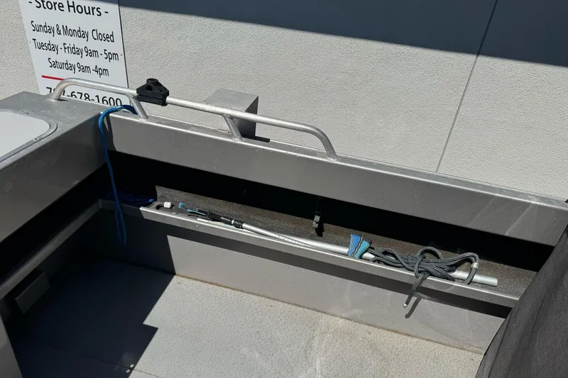Slide: The Image of Interior view of a 2011 North River 21' Seahawk boat, featuring storage compartments. - 17