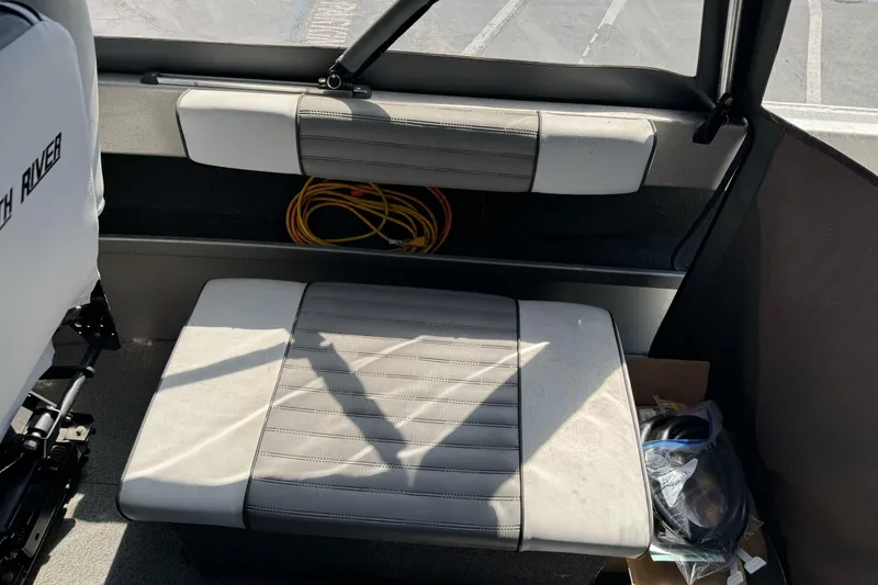 Slide: The Image of Interior of a 2011 North River 21' Seahawk boat with seating and storage. - 25