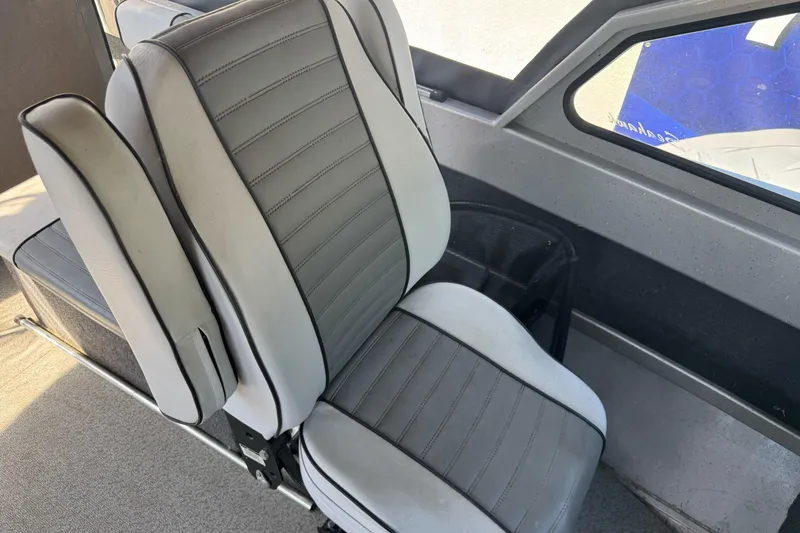 Slide: The Image of Gray and white interior seating of a 2011 North River 21' Seahawk boat. - 29