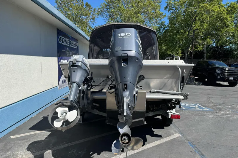 Slide: The Image of Rear view of a 2011 North River 21' Seahawk boat with dual outboard motors. - 3