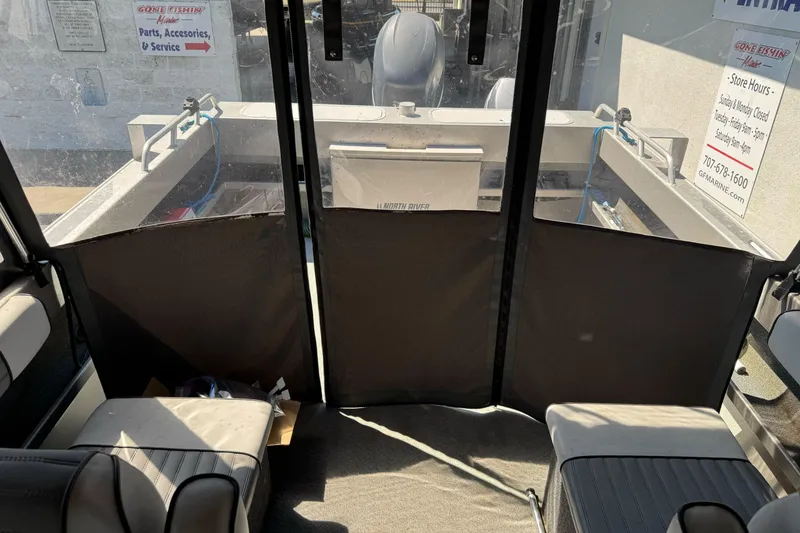 Slide: The Image of Interior view of a 2011 North River 21' Seahawk boat, showing seating and rear deck. - 30