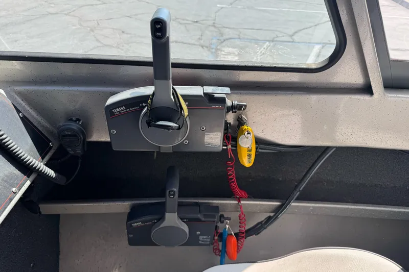 Slide: The Image of Control panel of a 2011 North River 21' Seahawk boat with Yamaha throttle controls. - 31