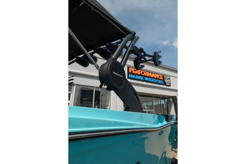 Slide: The Image of 2026 MasterCraft XT24 boat at Performance Marine Watersports dealership. - 17