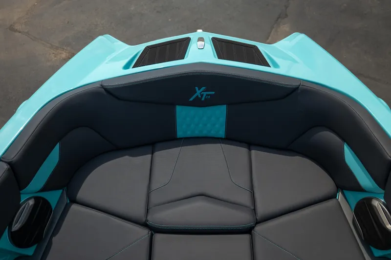 Slide: The Image of Interior seating of 2026 MasterCraft XT24 boat, featuring sleek design and turquoise accents. - 44