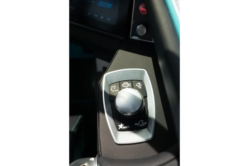 Slide: The Image of Control panel of 2026 MasterCraft XT24 boat with various function buttons. - 24