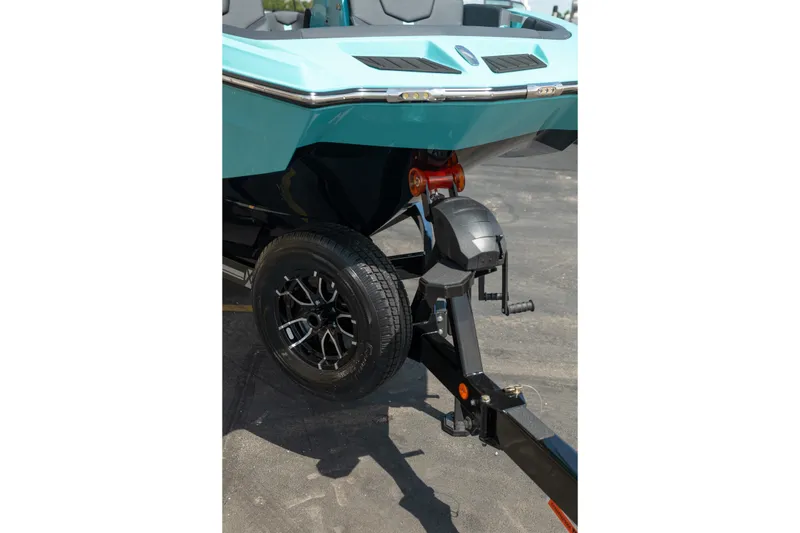 Slide: The Image of 2026 MasterCraft XT24 boat on trailer, showcasing sleek design and modern features. - 14