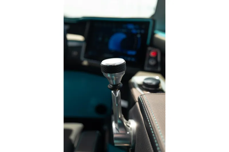 Slide: The Image of Close-up of 2026 MasterCraft XT24 boat throttle lever with digital display in background. - 23