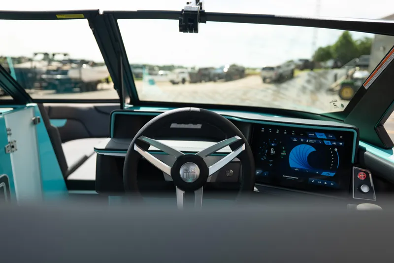 Slide: The Image of Interior view of 2026 MasterCraft XT24 boat with modern dashboard and steering wheel. - 21