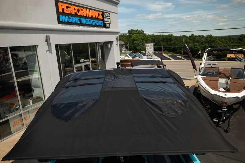 Slide: The Image of 2026 MasterCraft XT24 boat at Performance Marine Watersports dealership. - 45