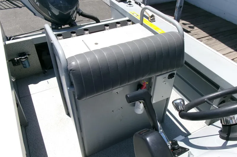 Slide: The Image of 2010 Klamath 19 Bayrunner Baja boat interior with steering wheel and control panel. - 13