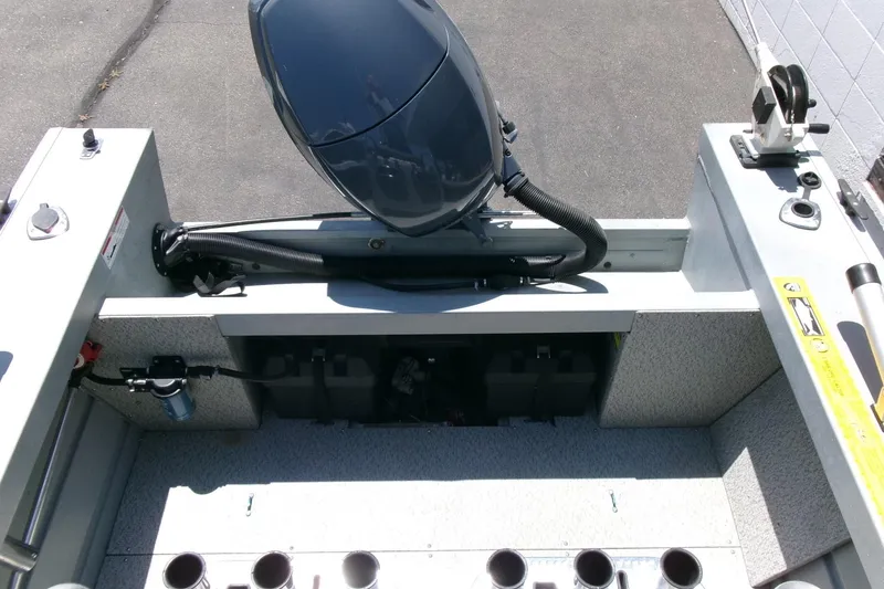 Slide: The Image of 2010 Klamath 19 Bayrunner Baja boat interior with motor and storage compartments. - 15