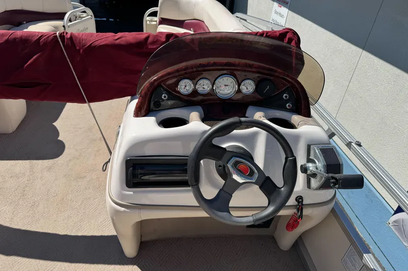 Slide: The Image of Steering console of a 2011 Sun Tracker Party Barge 21 pontoon boat. - 16