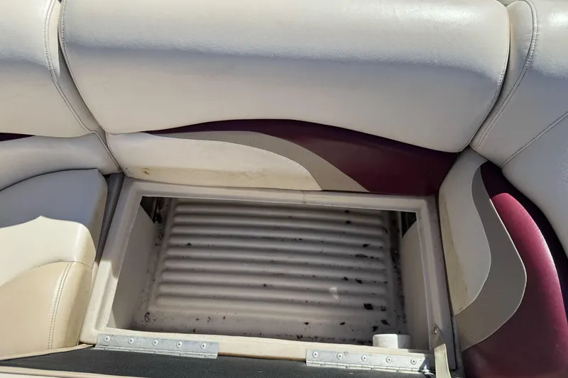 Slide: The Image of Open storage compartment on 2011 Sun Tracker Party Barge 21 boat seat. - 19