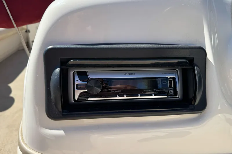 Slide: The Image of Kenwood stereo system on 2011 Sun Tracker Party Barge 21 boat dashboard. - 21
