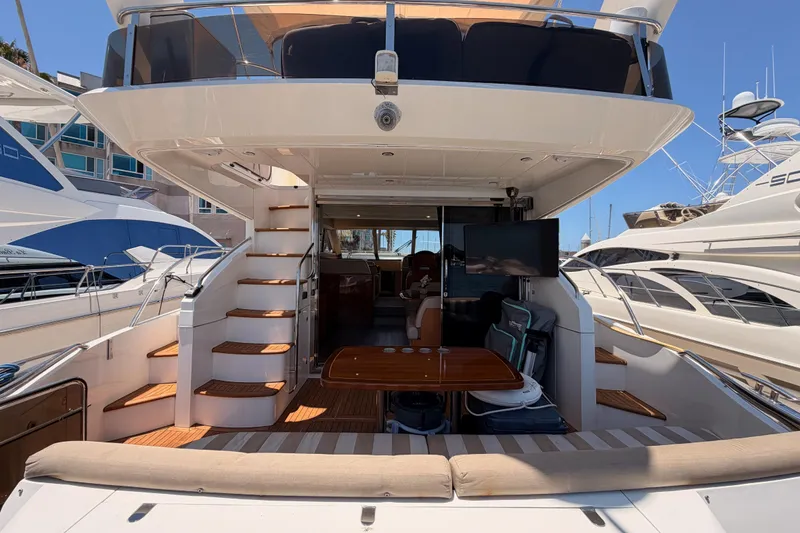 Slide: The Image of 2007 Viking Princess 54 Flybridge yacht with spacious deck and elegant interior design. - 11