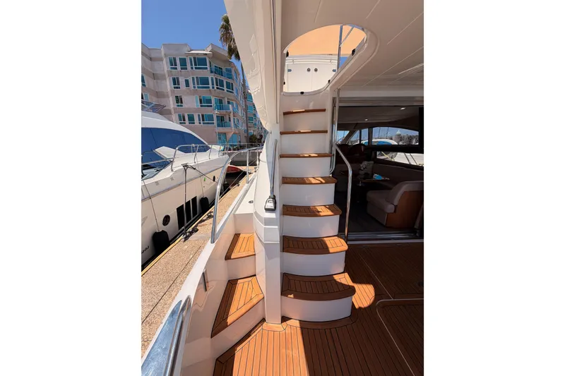Slide: The Image of 2007 Viking Princess 54 Flybridge yacht with elegant wooden stairs and modern interior. - 13
