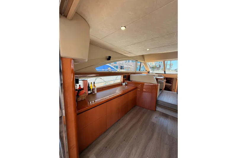 Slide: The Image of Luxurious interior of 2007 Viking Princess 54 Flybridge yacht with elegant wood finishes. - 26
