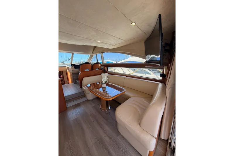 Slide: The Image of Luxurious interior of 2007 Viking Princess 54 Flybridge yacht with elegant seating and table. - 27